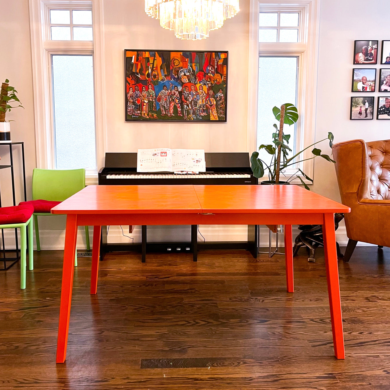 An orange table refinished by ARK Furniture Toronto a sustainable designer furniture store from Toronto, Canada. 