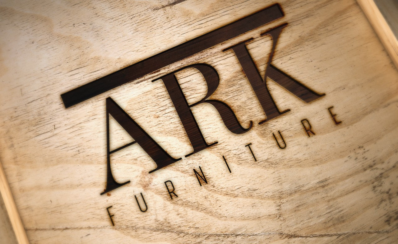 A wood box engraved with the ARK Furniture logo - a sustainable designer furniture company from Toronto, Canada