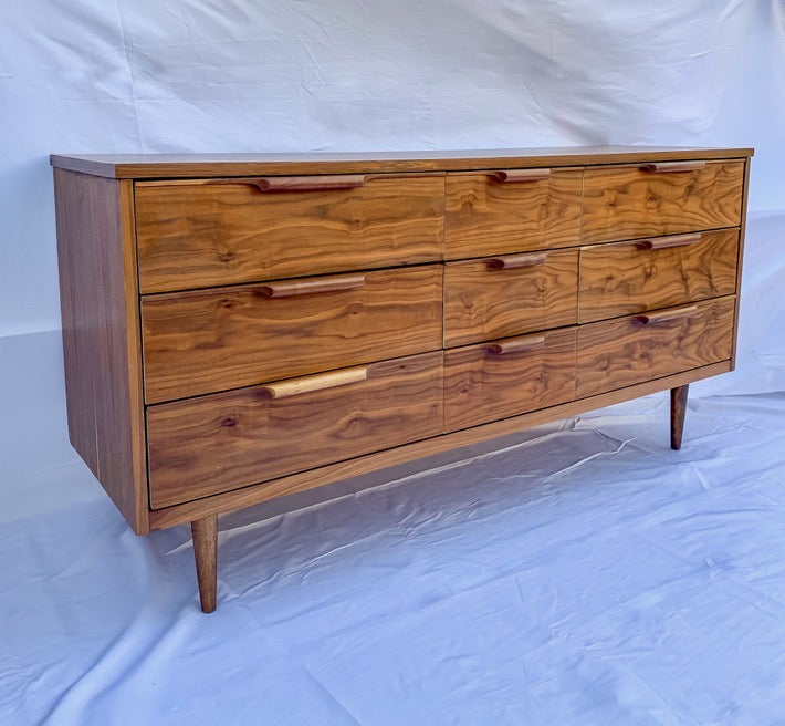 A walnut mcm 9 drawer dresser restored to original by ARK Furniture Toronto a sustainable designer furniture store from Toronto, Canada. 